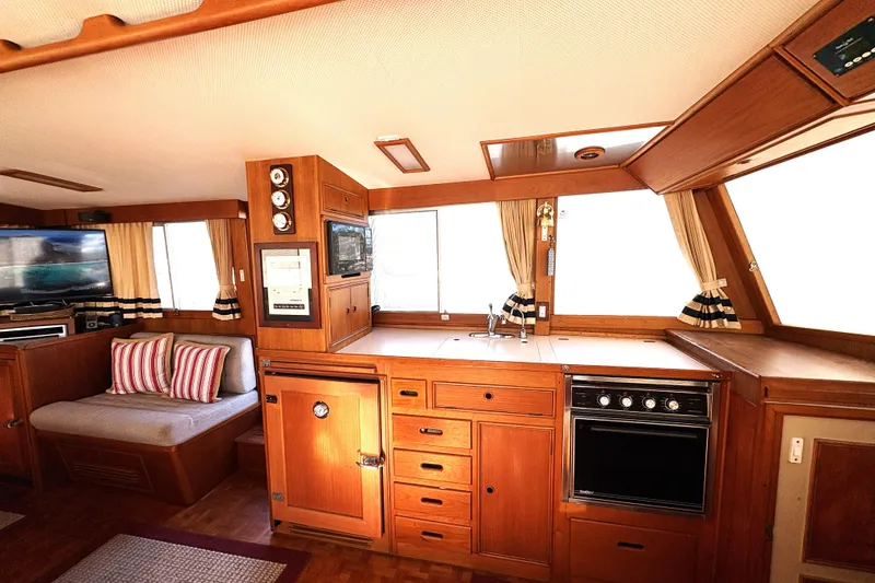 Slide: The Image of Interior of 1993 Grand Banks 42 Classic yacht with wood cabinetry and cozy seating area. - 30