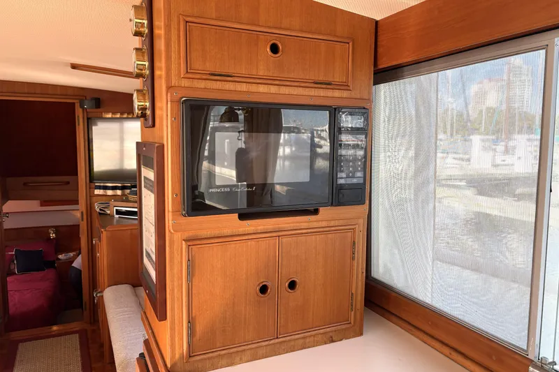 Slide: The Image of Interior of 1993 Grand Banks 42 Classic yacht with wood cabinetry and microwave. - 31