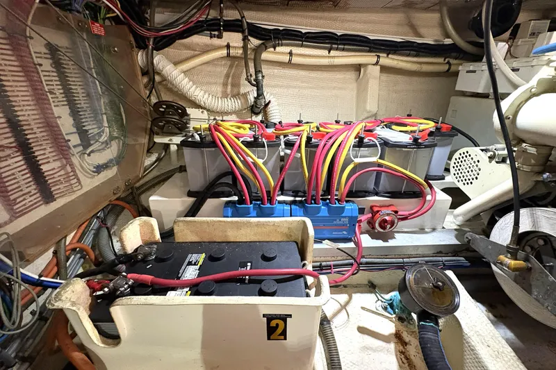 Slide: The Image of Engine room of 1993 Grand Banks 42 Classic with battery setup and wiring. - 34