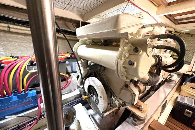 Slide: The Image of Engine room of a 1993 Grand Banks 42 Classic yacht, showcasing mechanical components. - 35