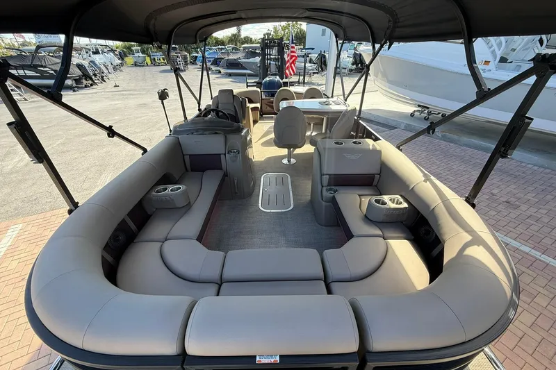 Slide: The Image of 2025 Bennington 23 LPD pontoon boat with spacious seating and modern design. - 11