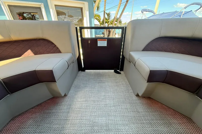 Slide: The Image of 2025 Bennington 23 LPD boat interior with plush seating and modern design. - 16