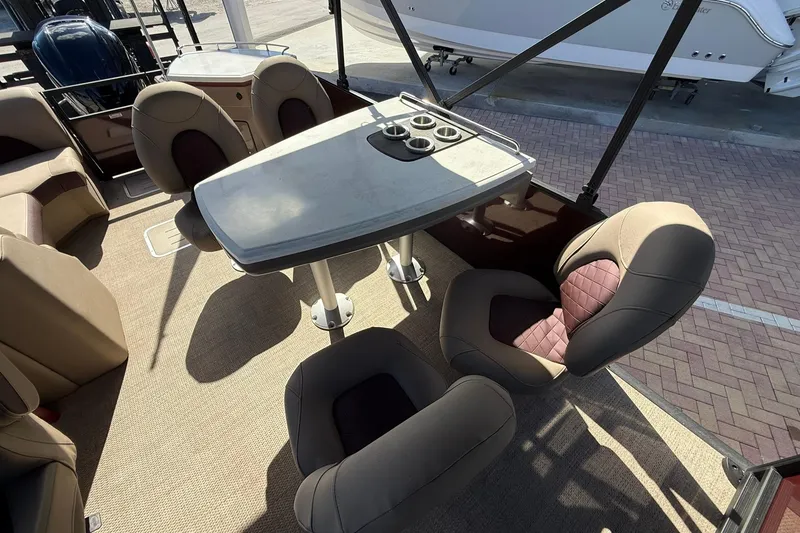 Slide: The Image of Interior of 2025 Bennington 23 LPD boat with seating and table setup. - 19