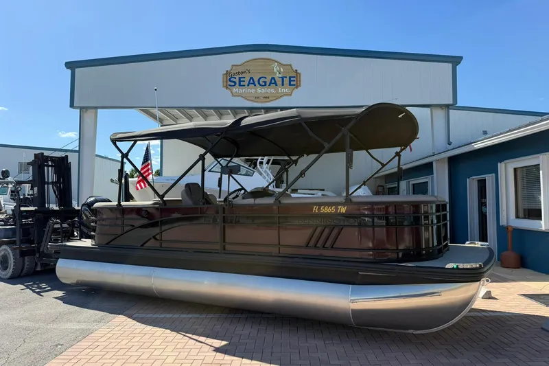 Slide: The Image of 2025 Bennington 23 LPD pontoon boat at Seagate Marine Sales dealership. - 2