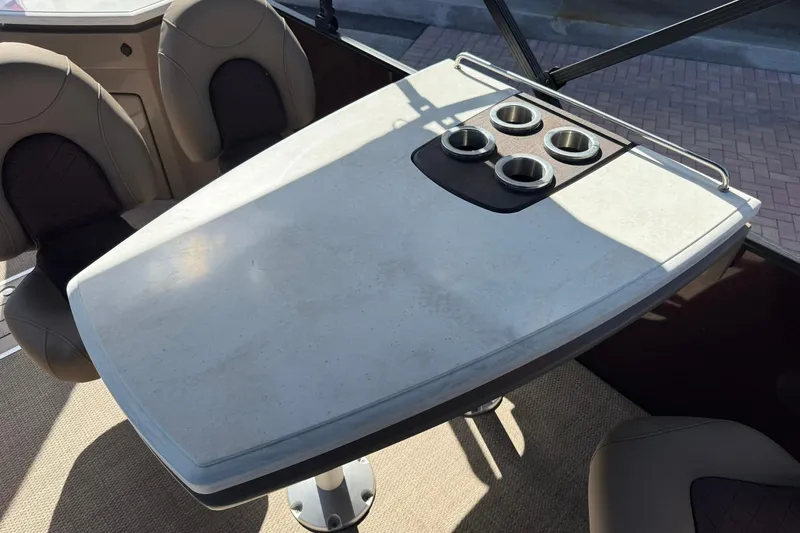 Slide: The Image of 2025 Bennington 23 LPD boat interior with table and cup holders. - 20