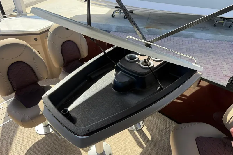 Slide: The Image of Interior of 2025 Bennington 23 LPD boat with seating and storage area. - 21