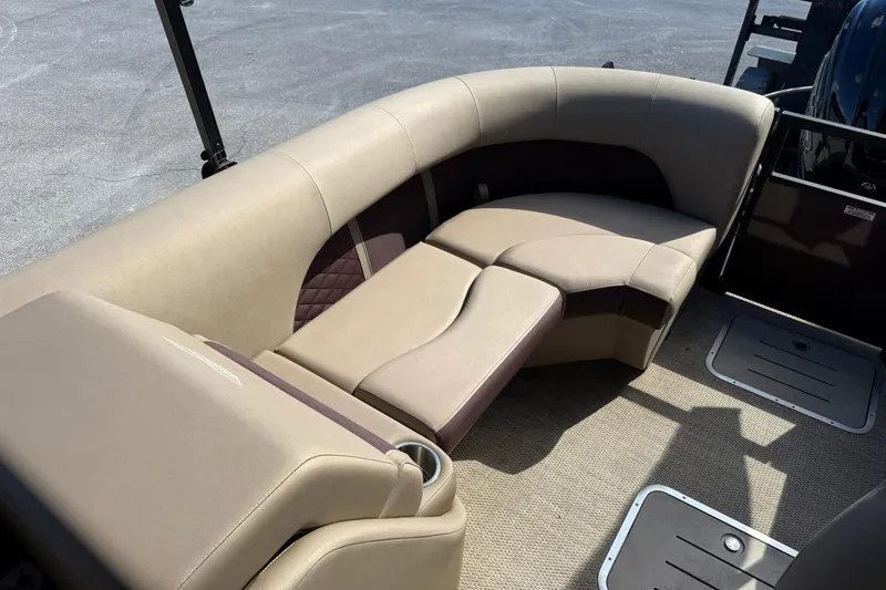 Slide: The Image of Luxurious seating on 2025 Bennington 23 LPD pontoon boat, featuring beige and brown upholstery. - 26