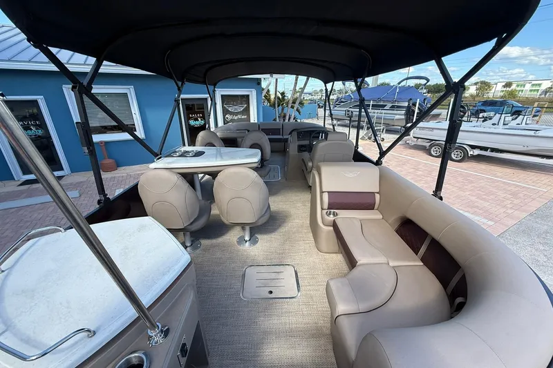 Slide: The Image of Interior of 2025 Bennington 23 LPD pontoon boat with seating and table. - 28