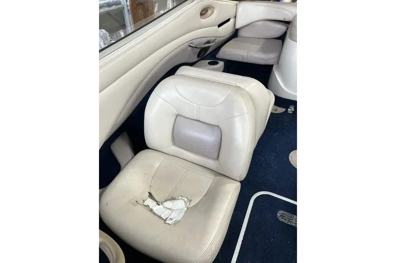 Slide: The Image of 1997 Regal Valanti 200 boat interior with beige leather seating. - 20