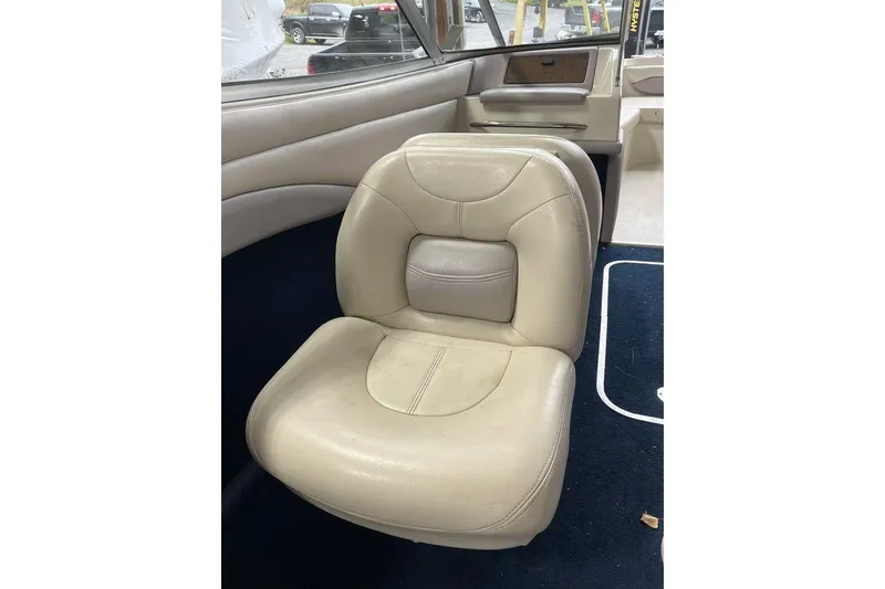 Slide: The Image of 1997 Regal Valanti 200 seat with torn white upholstery and visible wear. - 21