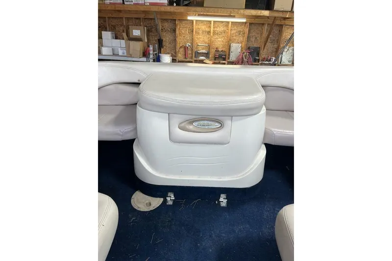Slide: The Image of White leather seating on 1997 Regal Valanti 200 boat, featuring cup holder and sleek design. - 24
