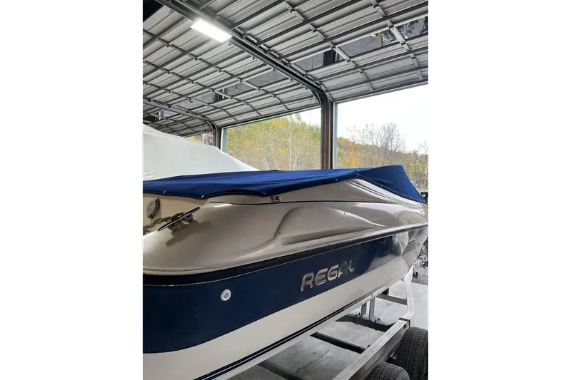Slide: The Image of 1997 Regal Valanti 200 boat in storage, covered and secured indoors. - 4