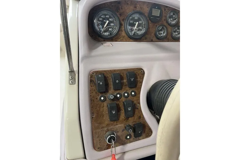 Slide: The Image of 1997 Regal Valanti 200 boat on trailer in garage setting. - 7