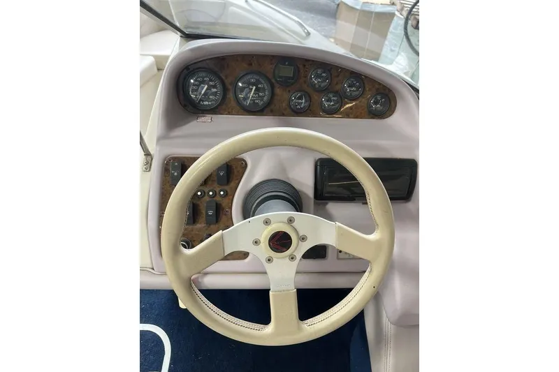 Slide: The Image of 1997 Regal Valanti 200 boat interior with white leather seating in a workshop setting. - 8