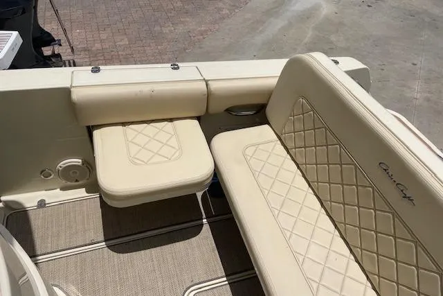 Slide: The Image of 2020 Chris-Craft Catalina 30 boat interior with beige quilted seating. - 12