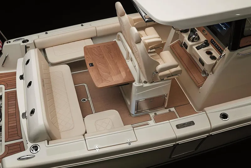 Slide: The Image of Manufacturer Provided Image: 2020 Chris-Craft Catalina 30 interior, featuring luxurious seating and a wooden table. - 13