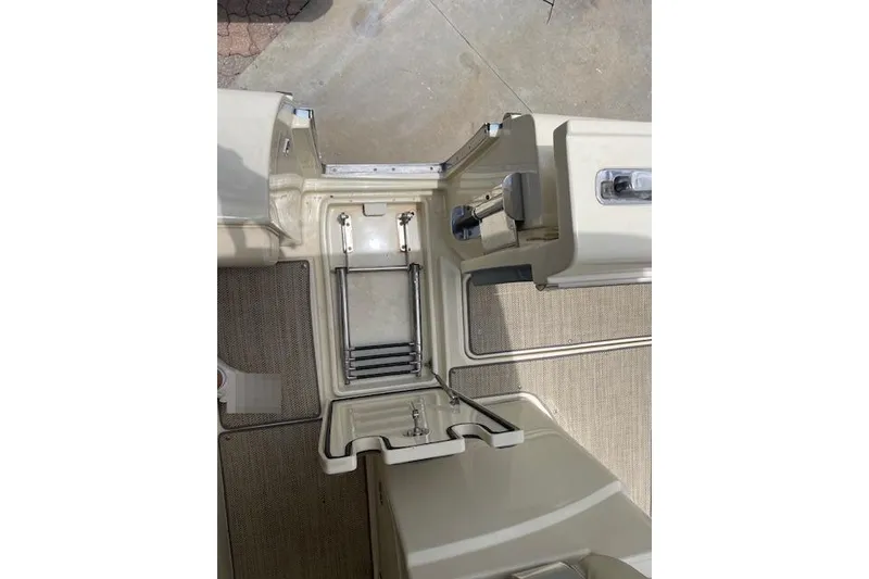 Slide: The Image of 2020 Chris-Craft Catalina 30 boat interior with ladder and storage compartments. - 17