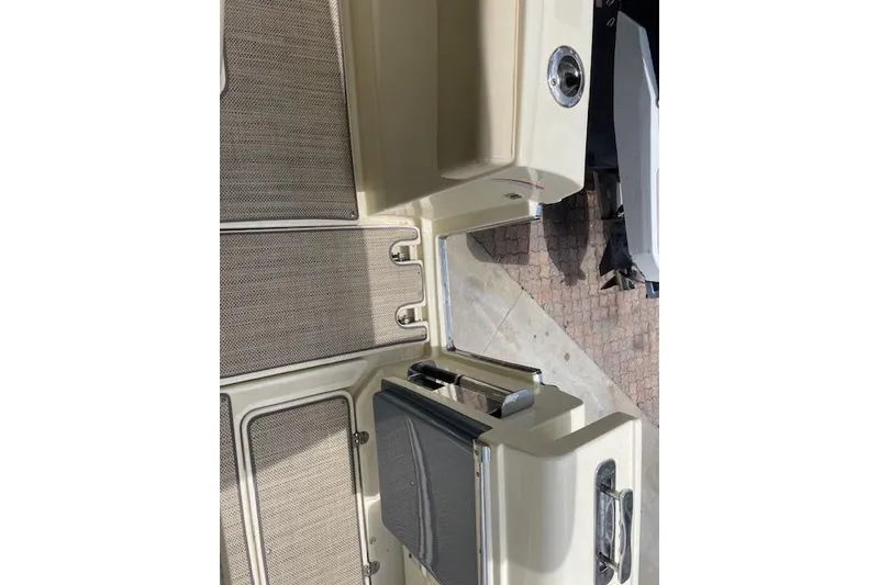 Slide: The Image of 2020 Chris-Craft Catalina 30 boat interior with beige flooring and sleek design. - 18