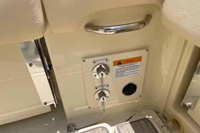 Slide: The Image of 2020 Chris-Craft Catalina 30 boat interior with control panel and safety warning. - 19