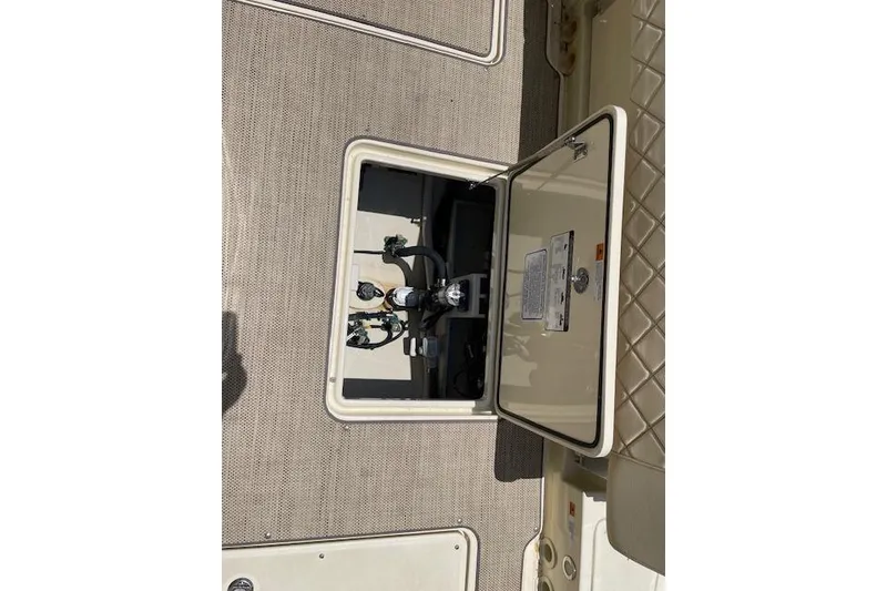 Slide: The Image of Open hatch on 2020 Chris-Craft Catalina 30 boat deck, revealing interior components. - 20