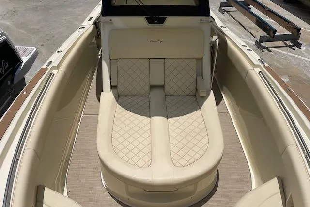 Slide: The Image of 2020 Chris-Craft Catalina 30 boat interior with beige quilted seating. - 33