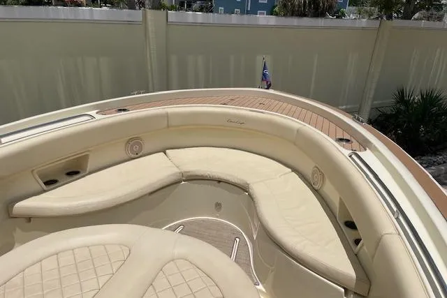Slide: The Image of 2020 Chris-Craft Catalina 30 boat with luxurious beige seating and wooden deck. - 35