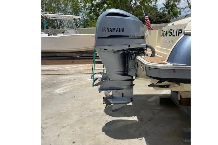 Slide: The Image of 2020 Chris-Craft Catalina 30 with Yamaha outboard motor, docked in a sunny marina. - 6
