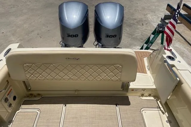 Slide: The Image of 2020 Chris-Craft Catalina 30 boat with twin 300 horsepower engines and American flag. - 8