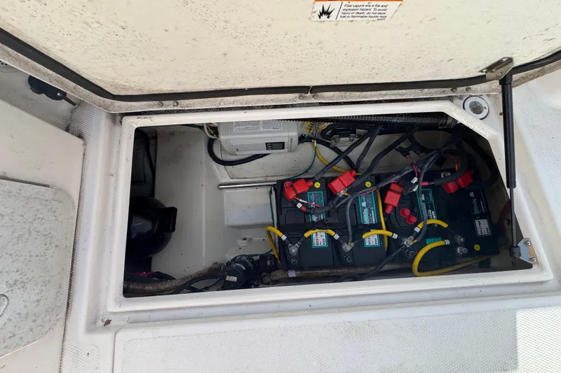 Slide: The Image of Battery compartment of a 2021 Ranger Tugs R-25 boat, showing wiring and connections. - 10