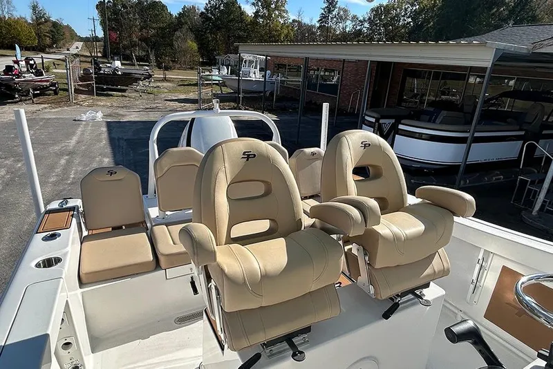 Slide: The Image of 2026 Sea Pro 245FLX Sandbar boat with beige seating and modern design. - 16