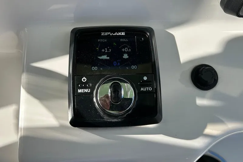 Slide: The Image of Zipwake control panel on 2026 Sea Pro 245FLX Sandbar boat dashboard. - 20