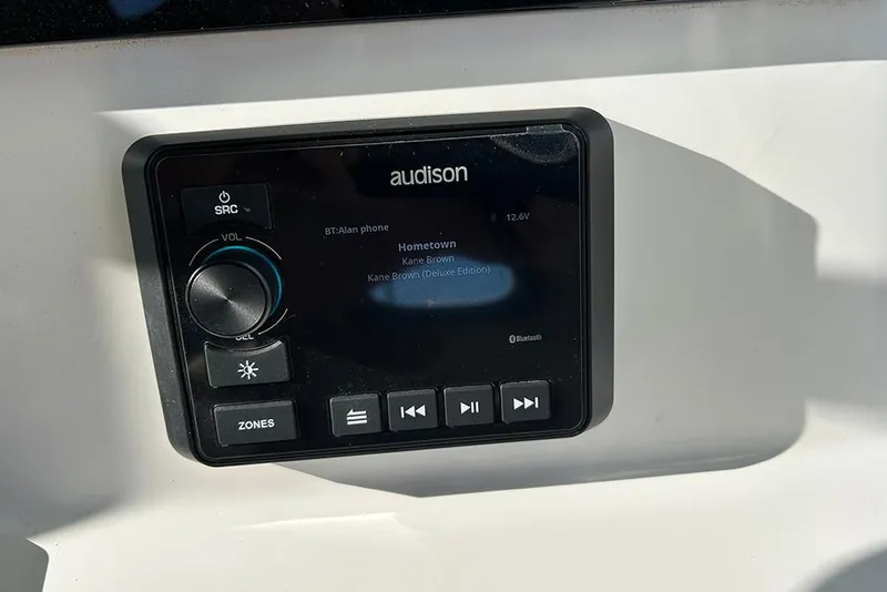 Slide: The Image of Audio system on 2026 Sea Pro 245FLX Sandbar boat, displaying music track details. - 21