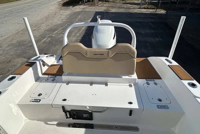 Slide: The Image of 2026 Sea Pro 245FLX Sandbar boat interior with seating and storage compartments. - 25