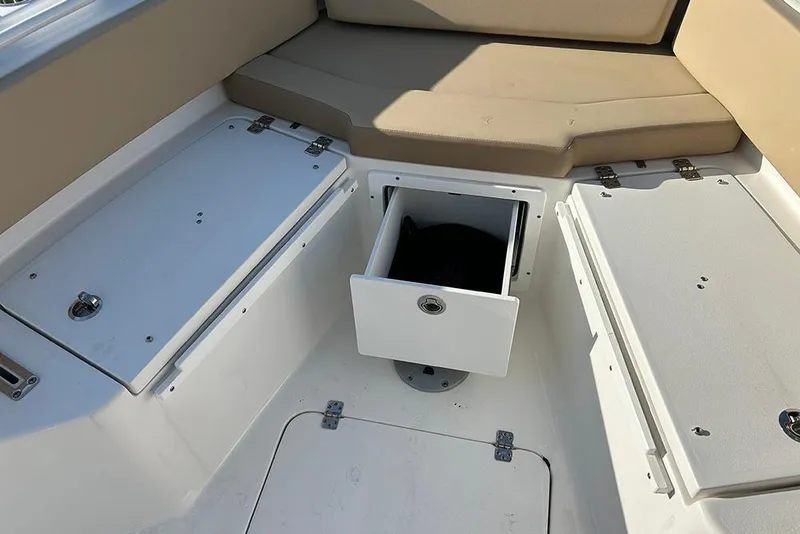 Slide: The Image of Interior view of 2026 Sea Pro 245FLX Sandbar boat with storage compartments. - 36