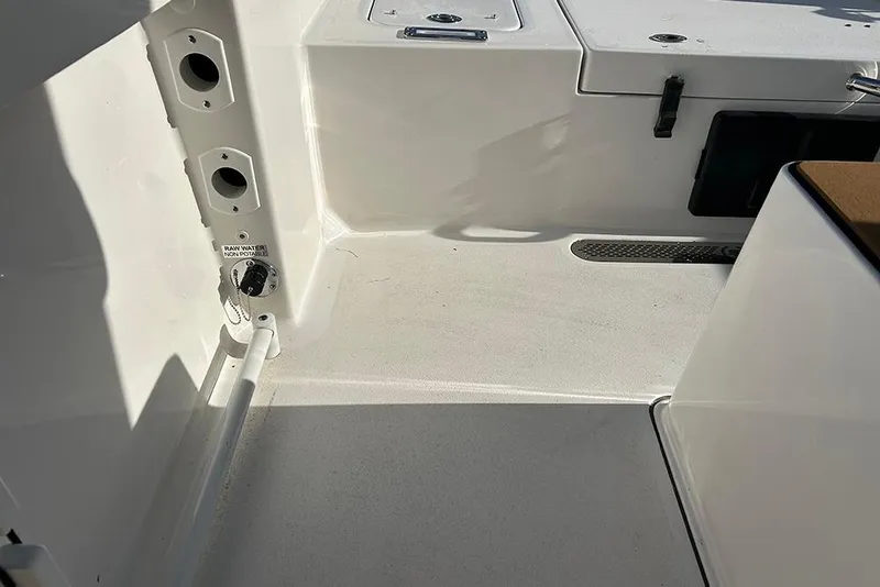 Slide: The Image of Interior view of 2026 Sea Pro 245FLX Sandbar boat, featuring storage compartments. - 39