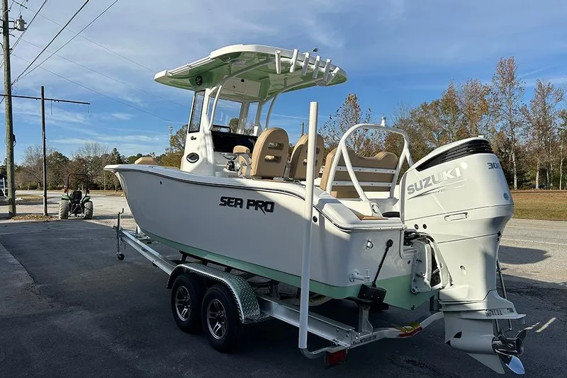 Slide: The Image of 2026 Sea Pro 245FLX Sandbar boat on trailer with Suzuki outboard motor. - 4