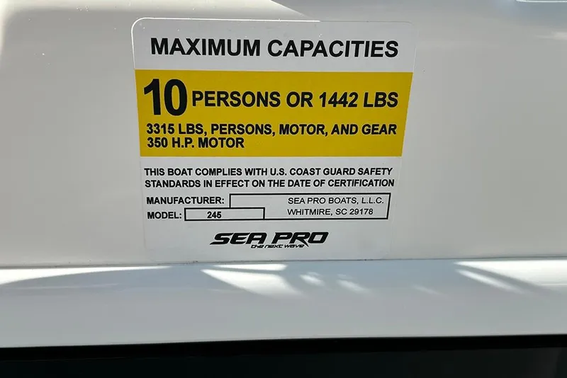 Slide: The Image of 2026 Sea Pro 245FLX Sandbar boat capacity label, 10 persons or 1442 lbs, 350 HP motor. - 40