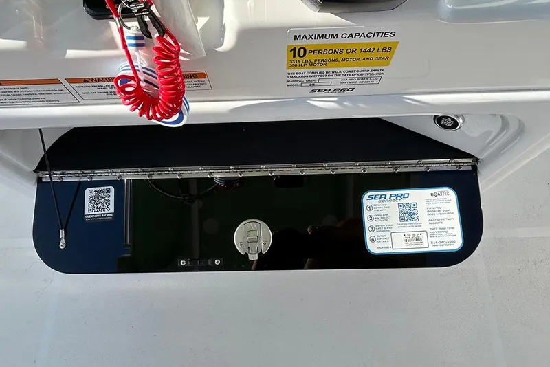 Slide: The Image of 2026 Sea Pro 245FLX Sandbar boat dashboard with capacity and safety labels. - 41