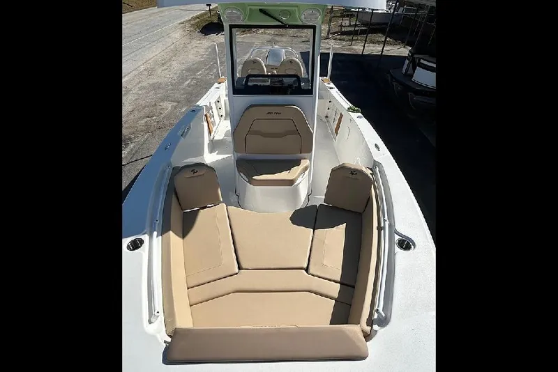 Slide: The Image of 2026 Sea Pro 245FLX Sandbar boat with beige seating and sleek design. - 52