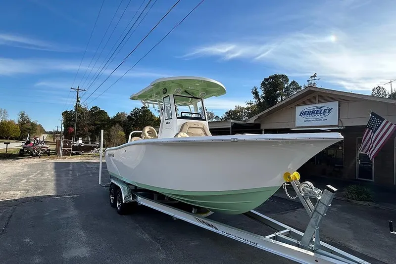 Slide: The Image of 2026 Sea Pro 245FLX Sandbar boat on trailer outside Berkeley Outdoors dealership. - 6