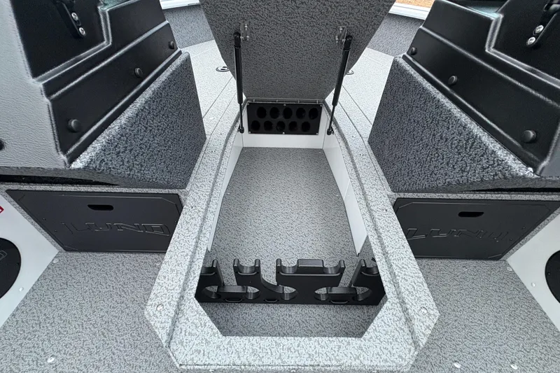 Slide: The Image of 2026 Lund 1800 Explorer Sport boat interior with open storage compartment. - 16