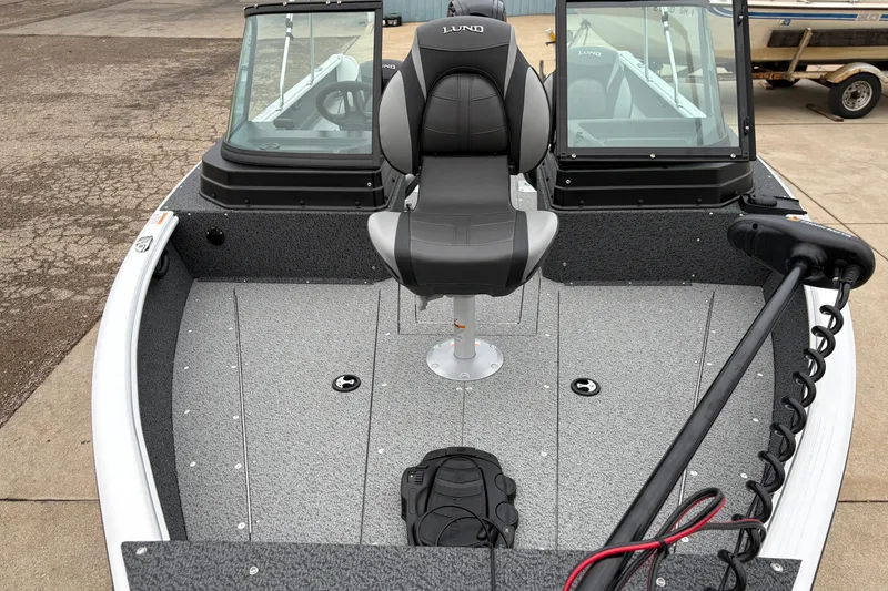 Slide: The Image of 2026 Lund 1800 Explorer Sport boat interior with seating and controls. - 8