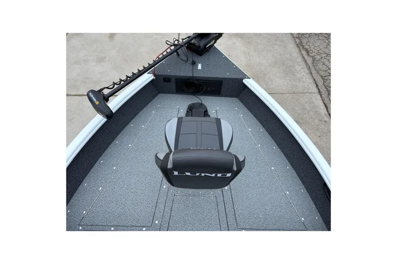 Slide: The Image of 2026 Lund 1800 Explorer Sport boat interior with seating and trolling motor. - 9