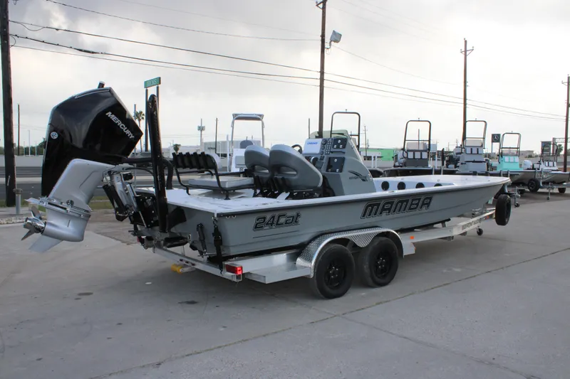 Slide: The Image of 2026 Mamba 24 Cat Elite boat on trailer, featuring Mercury outboard motor. - 10