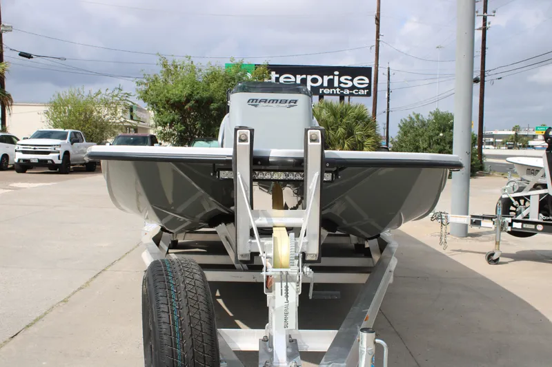 Slide: The Image of 2026 Mamba 24 Cat Elite boat on trailer at rental location. - 11