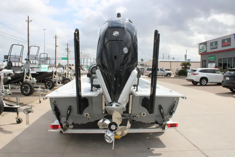 Slide: The Image of 2026 Mamba 24 Cat Elite boat with powerful outboard motor, parked on a trailer. - 12
