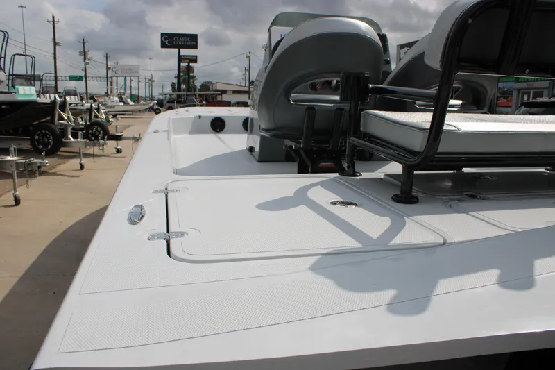 Slide: The Image of 2026 Mamba 24 Cat Elite boat on display at a dealership. - 13