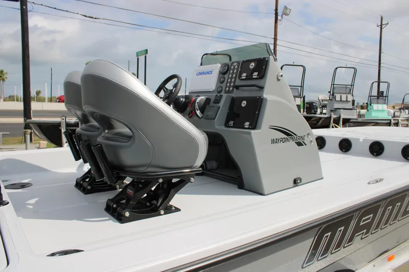 Slide: The Image of 2026 Mamba 24 Cat Elite boat interior with dual seats and advanced control panel. - 14