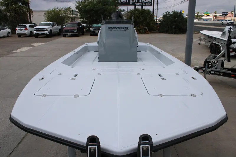 Slide: The Image of 2026 Mamba 24 Cat Elite boat on display in a parking lot. - 15