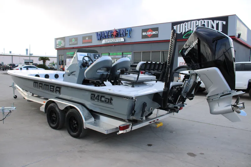 Slide: The Image of 2026 Mamba 24 Cat Elite boat with Mercury engine at dealership. - 2